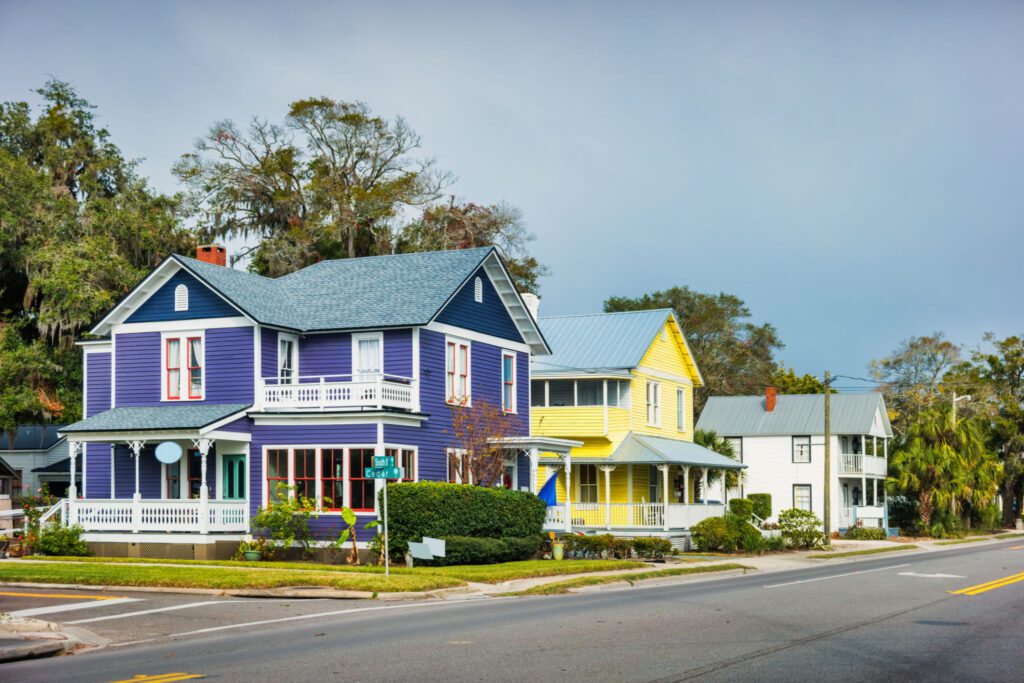 Colorful houses along a suburban street.